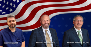 Veterans Day banner with 3 staff members in front of waving American flag